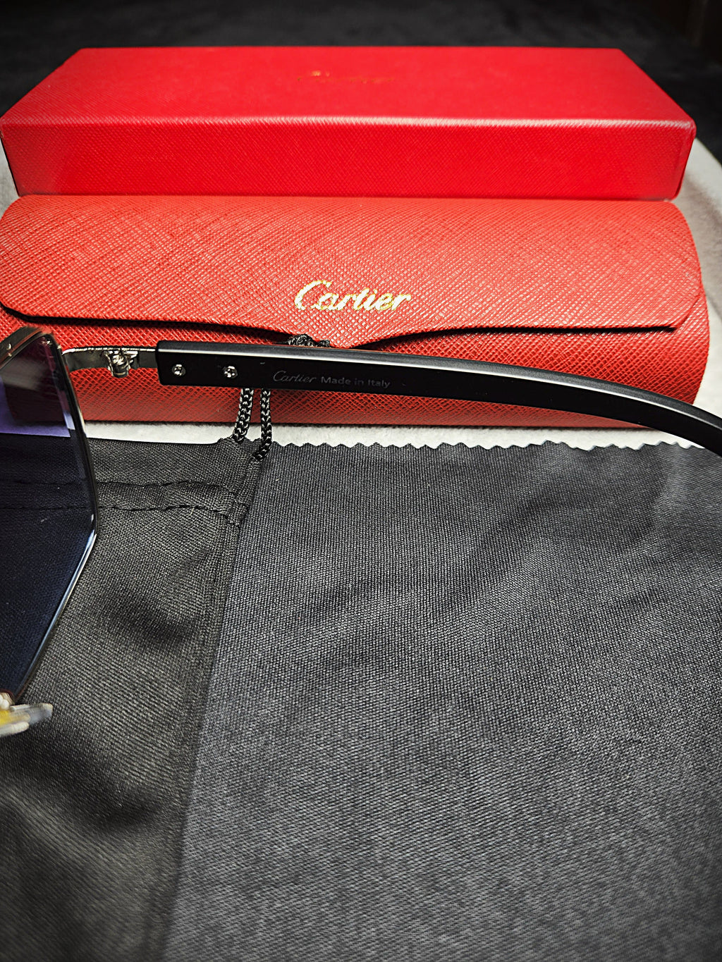 Cartier Black Frame Eyeglasses with Blue-Tinted Lenses